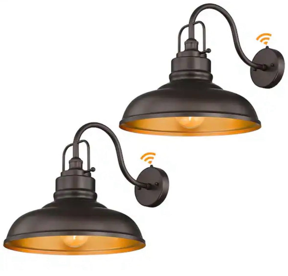 JAZAVA 17.7 in. hardwired outdoor wall sconce with dusk to dawn sensor, oil-rubbed bronze finish, and gold interior shade.