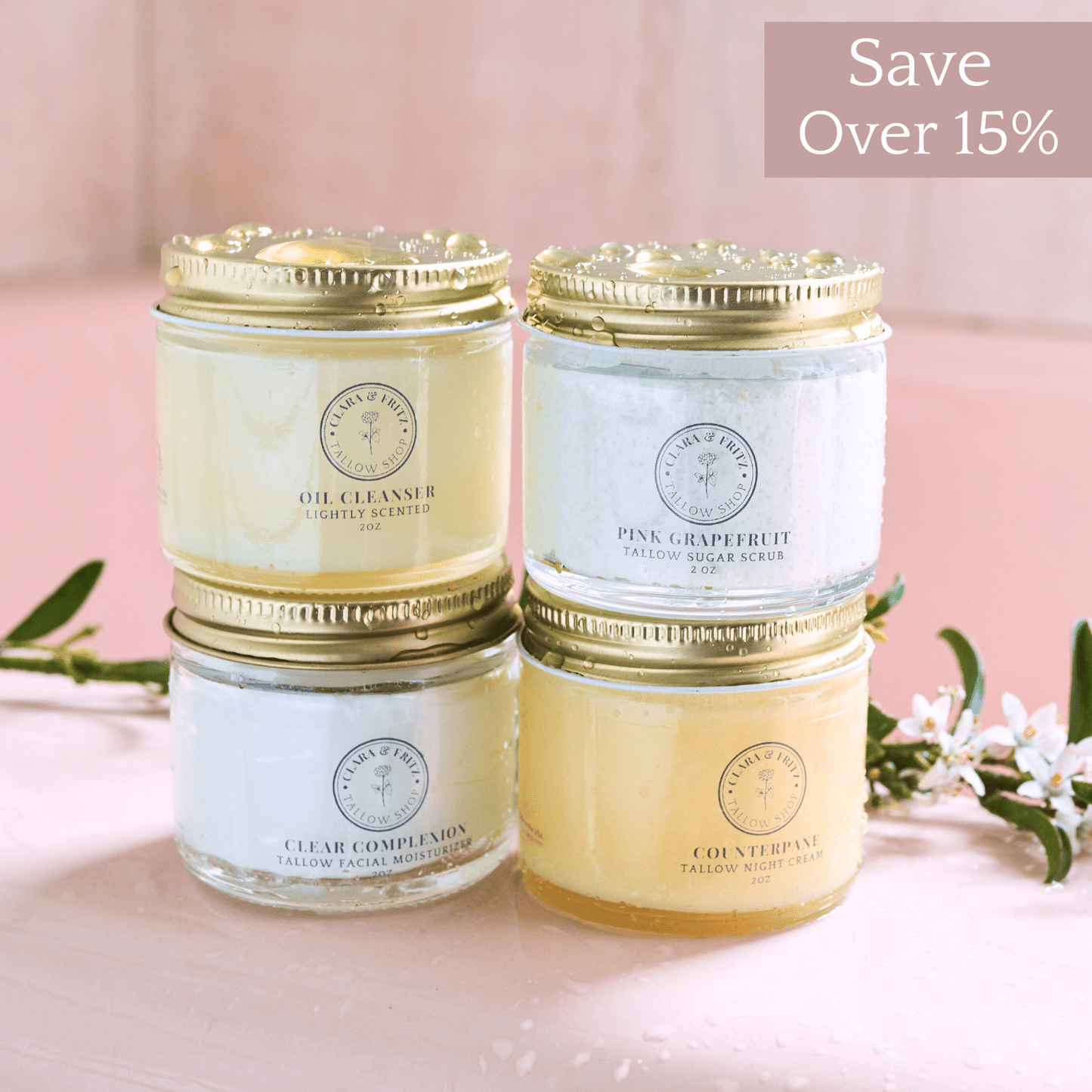 Capsule Skincare Kit with four tallow-based facial products including Oil Cleanser, Pink Grapefruit Sugar Scrub, Clear Complexion Moisturizer, and Counterpane Night Cream in glass jars with gold lids.
