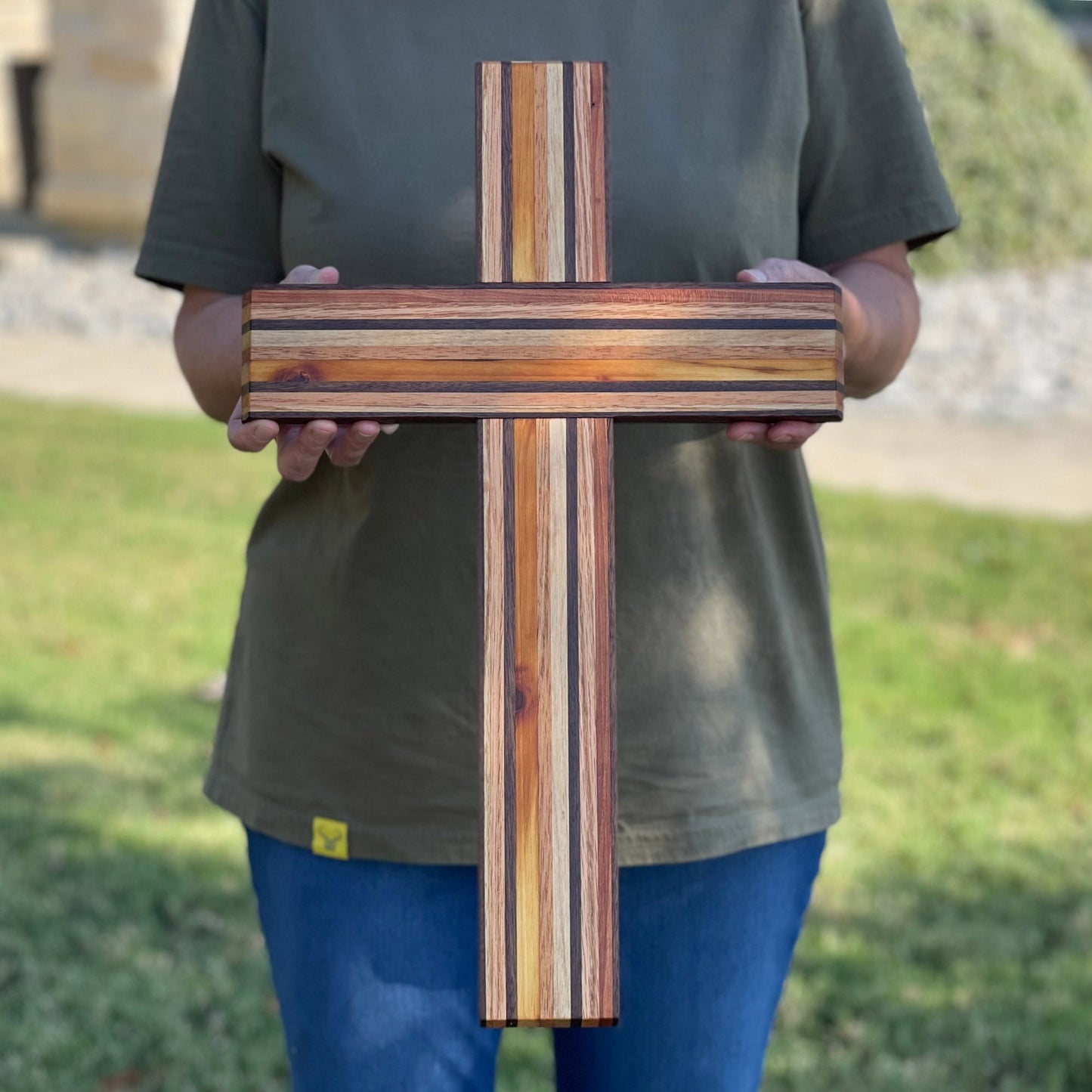 Handheld Remnant Cross made from various reclaimed woods with striped multi-color pattern