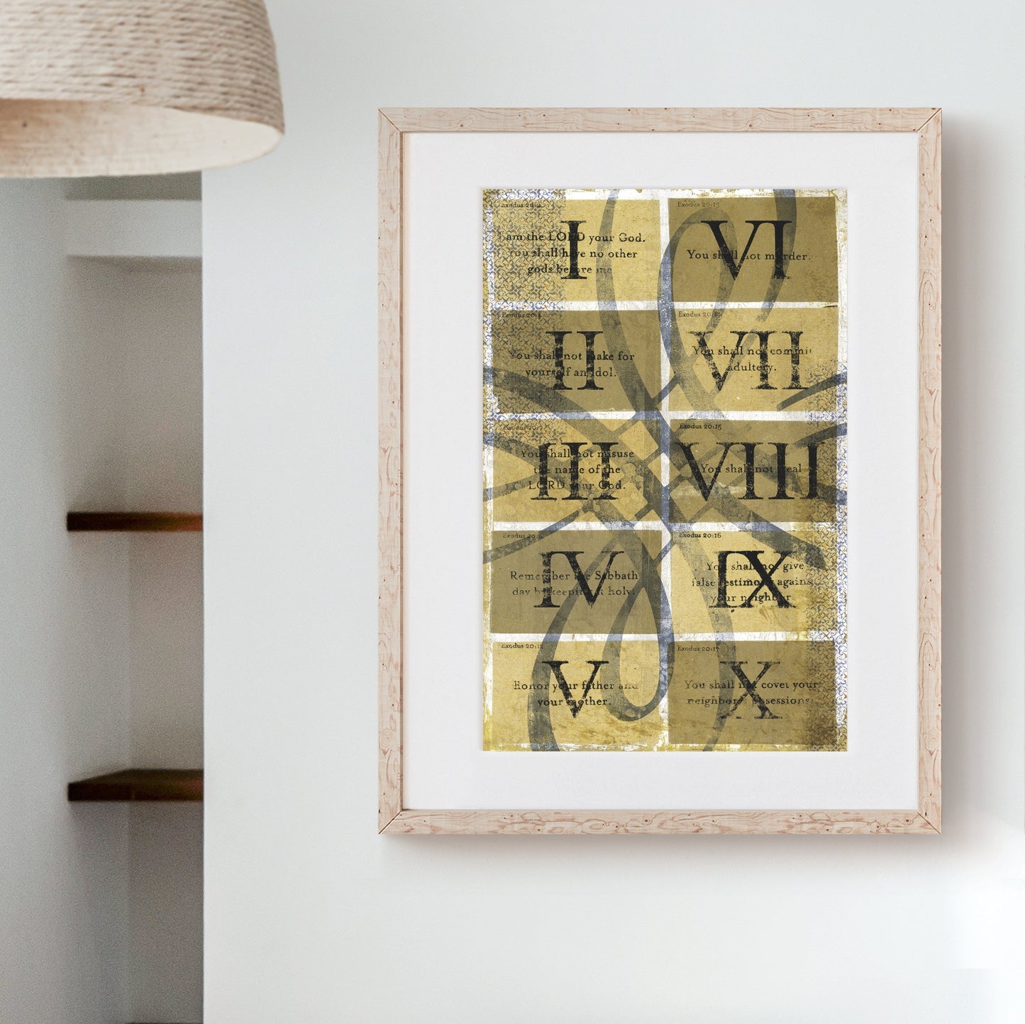 The Ten Commandments Art Print with vintage scrollwork and Roman numerals in a wooden frame on a wall