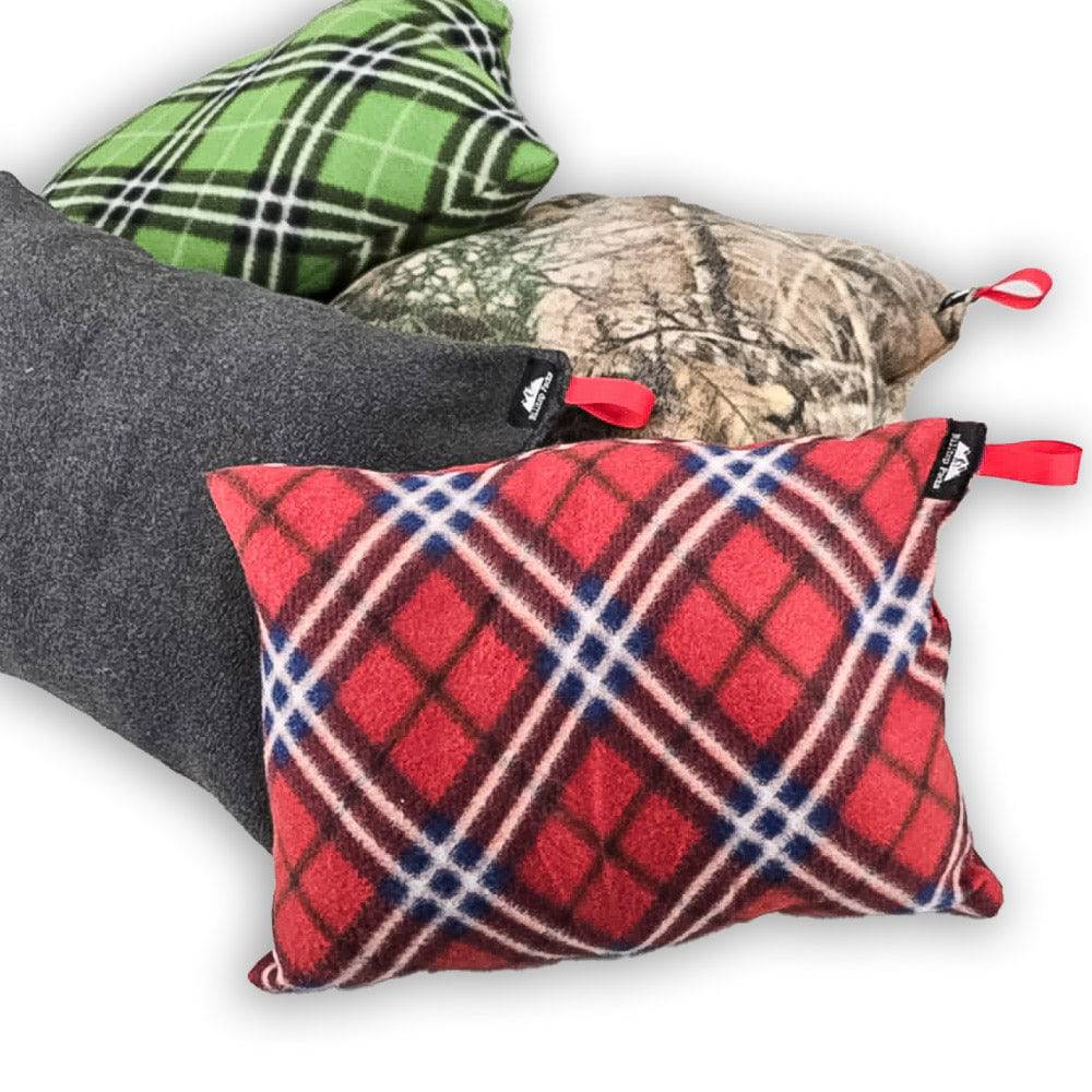 Four RFP Pillows by Hilltop Packs in various patterns including red and blue plaid, green plaid, camouflage, and solid gray with red hanging tabs.