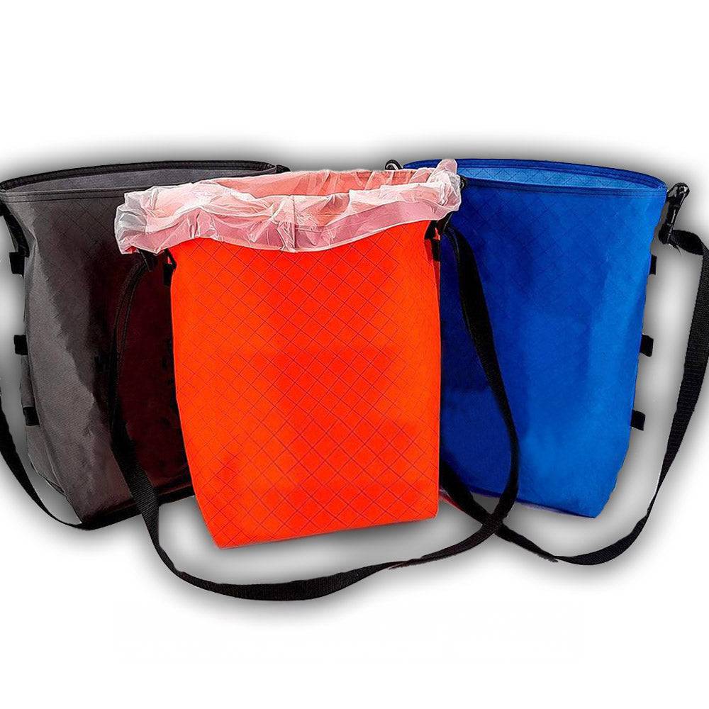 Trail Maintenance Trash Bags in black, orange, and blue with adjustable shoulder straps and flat bottoms for easy dumping