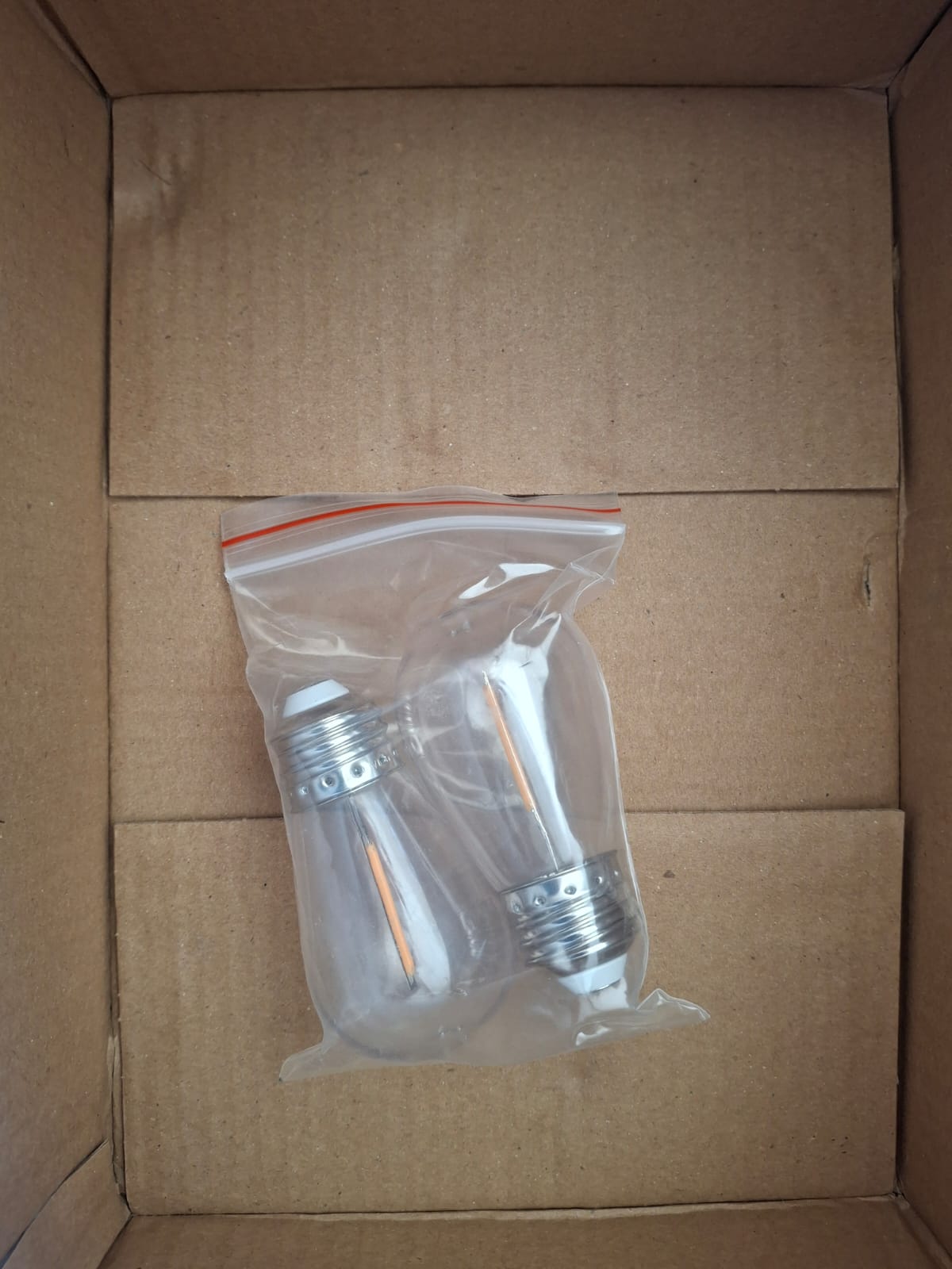 Open box Hampton Bay 12-Light 24 ft. Plug-in Indoor/Outdoor Edison String Light with S14 Single Filament LED Bulbs