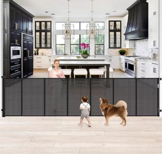 Extra tall and wide retractable baby gate with reinforced mesh for pets and babies in modern kitchen setting