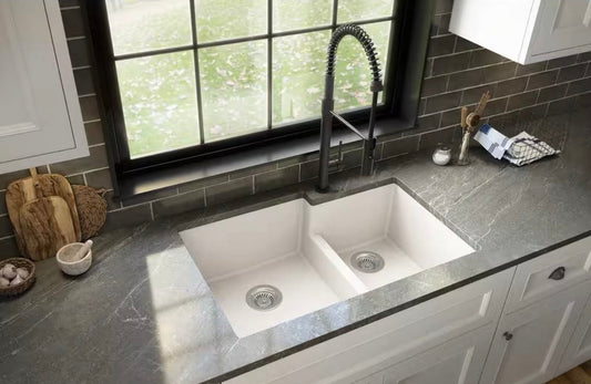 Modern Karran Quartz/Granite White 33 in. 60/40 double bowl composite undermount kitchen sink in gray countertop with black faucet and window background