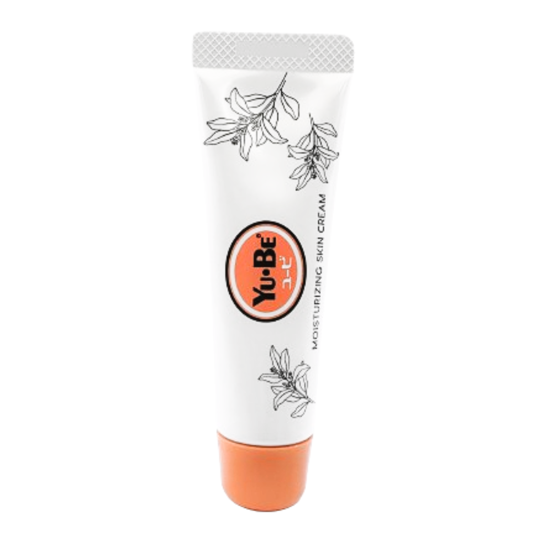 Tube of Yu-Be Moisturizing Skin Cream with botanical design and orange cap for hydrating and soothing dry skin