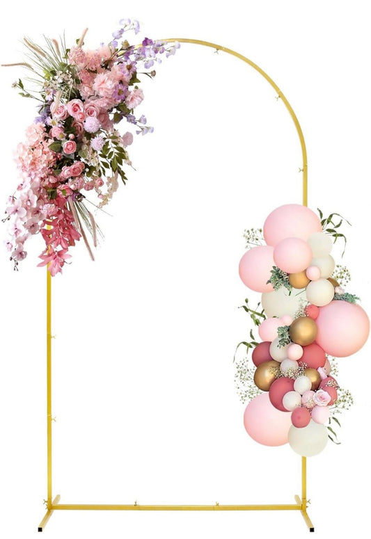 Gold metal wedding arch backdrop stand decorated with pink and white balloons and floral arrangements