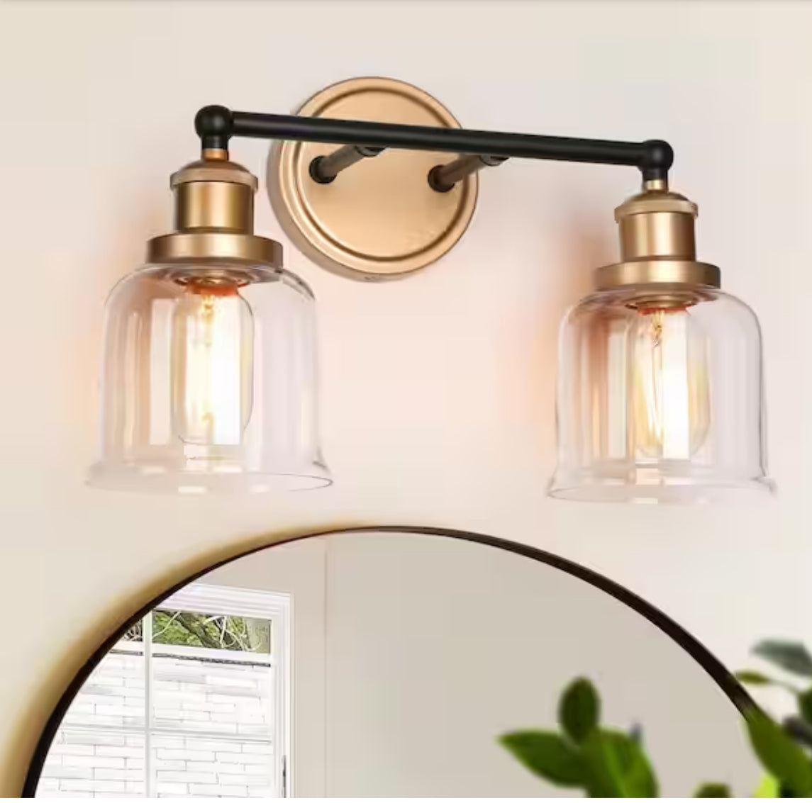 Uolfin Modern Dome bathroom vanity light with black and brass finish, clear glass shades, installed above a mirror.