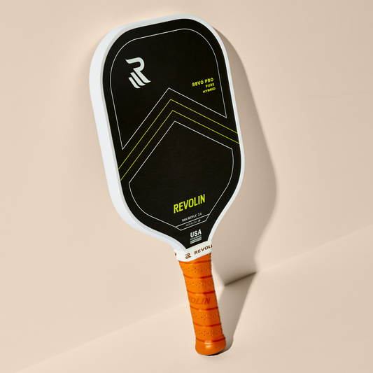 REVO PRO Pure Hybrid pickleball paddle with volcanic rock Raw Lava FLX face, 16mm poly core, and orange grip for power and control.