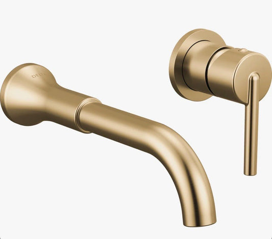 Delta Trinsic wall mount bathroom faucet in brushed gold finish for vanity sink