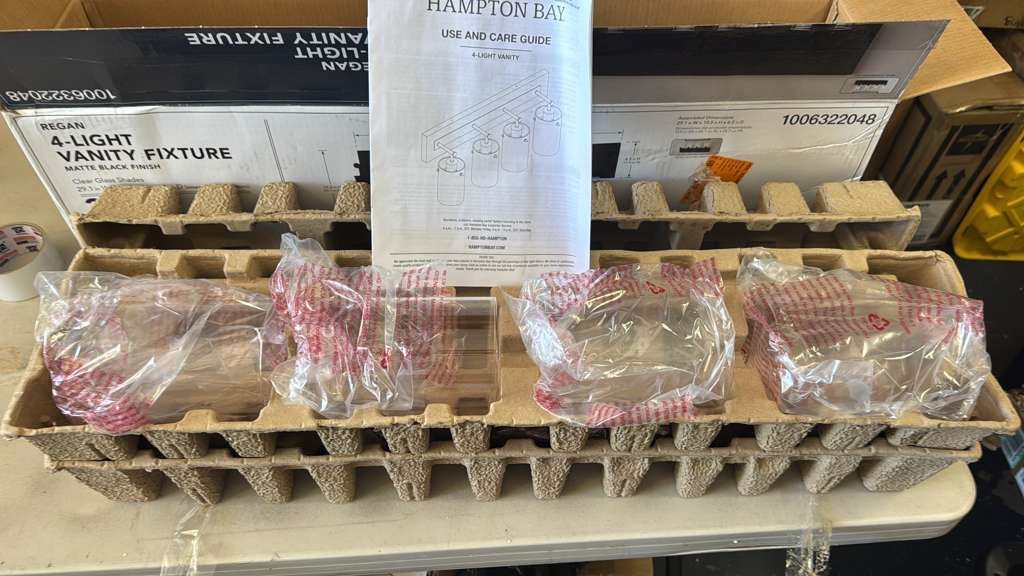 Hampton Bay  Regan 29.25 in. 4-Light Matte Black Bathroom Vanity Light with Clear Glass Shades