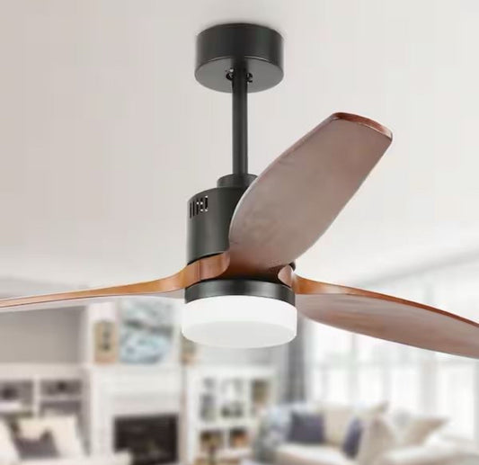 Close-up of Oaks Aura Novella matte black ceiling fan with solid wood blades and integrated LED light in modern living room