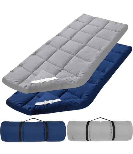 Cot mattress topper with improved thickness, quilted design, shown in grey and blue; rolls up for easy transport.