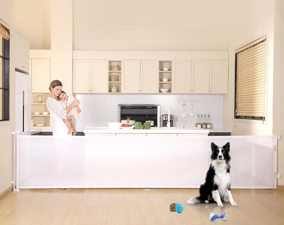 HDUYFYD 150 inches extra wide retractable baby gate in a kitchen setting, ideal for large openings and pet safety.