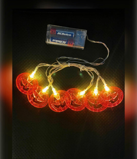Seasonal Specialties pumpkin string lights with six glowing jack-o'-lanterns for Halloween decor