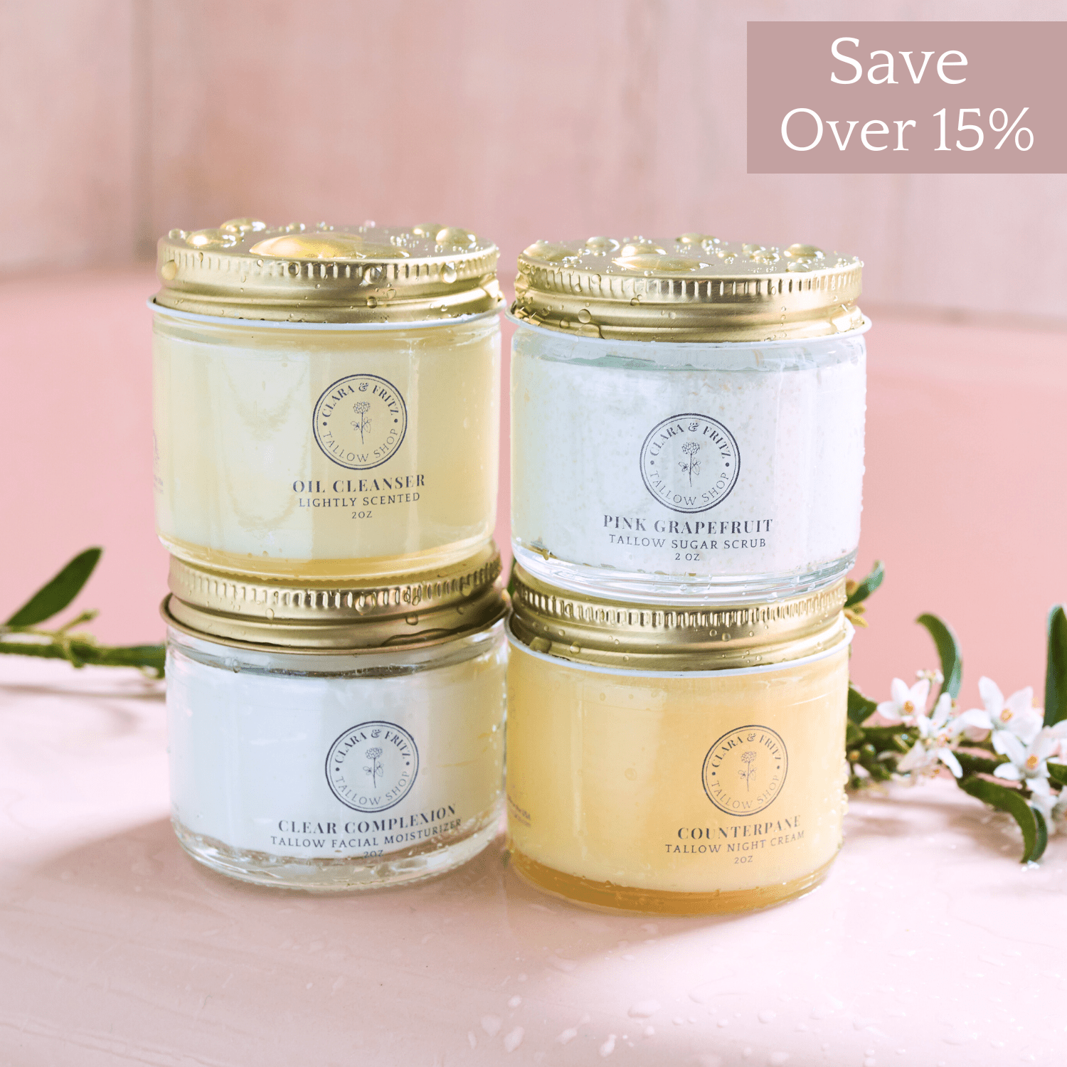 Capsule Skincare Kit with four tallow-based facial products including Oil Cleanser, Pink Grapefruit Sugar Scrub, Clear Complexion Moisturizer, and Counterpane Night Cream in glass jars with gold lids.