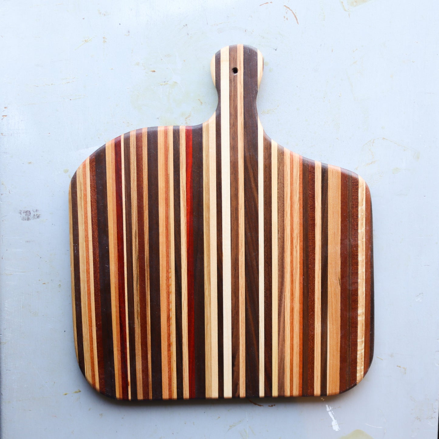 Handmade charcuterie serving platter with laminated striped reclaimed hardwoods and a handle