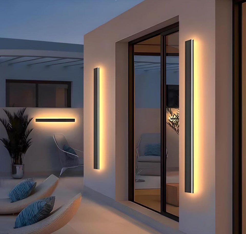 Levxhotty 59 inch modern outdoor wall lights with dimmable feature and remote control, installed on house exterior.