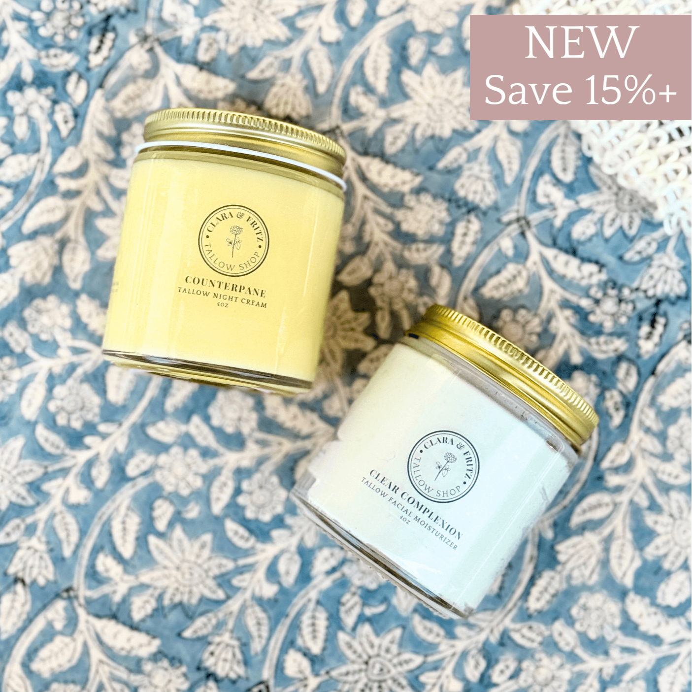 Day & Night Duo skincare set with Clear Complexion whipped tallow moisturizer and Counterpane tallow night cream in glass jars on floral fabric background