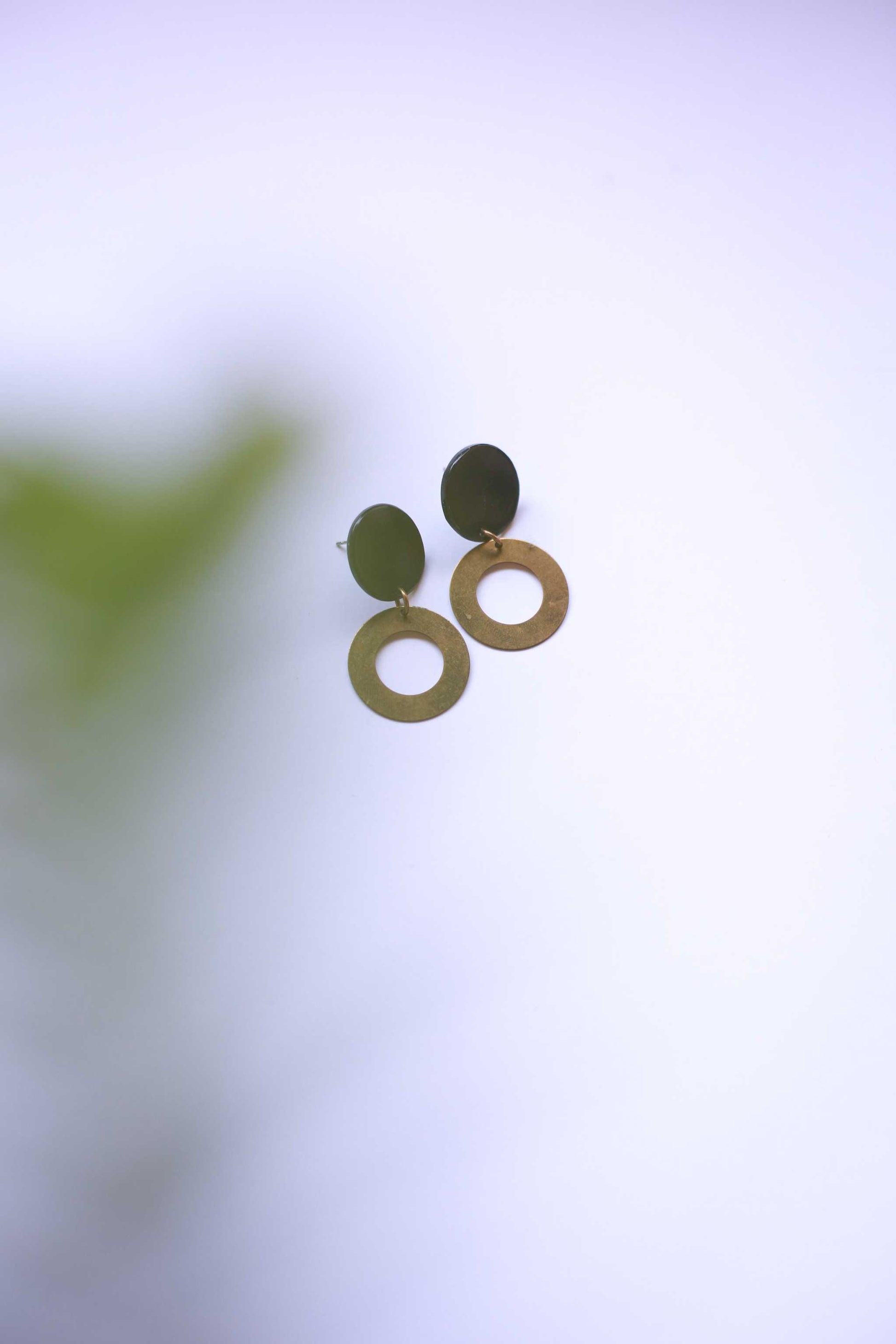 Maggie Earring featuring natural horn round base and brass circle drop with surgical steel hooks in minimalist style