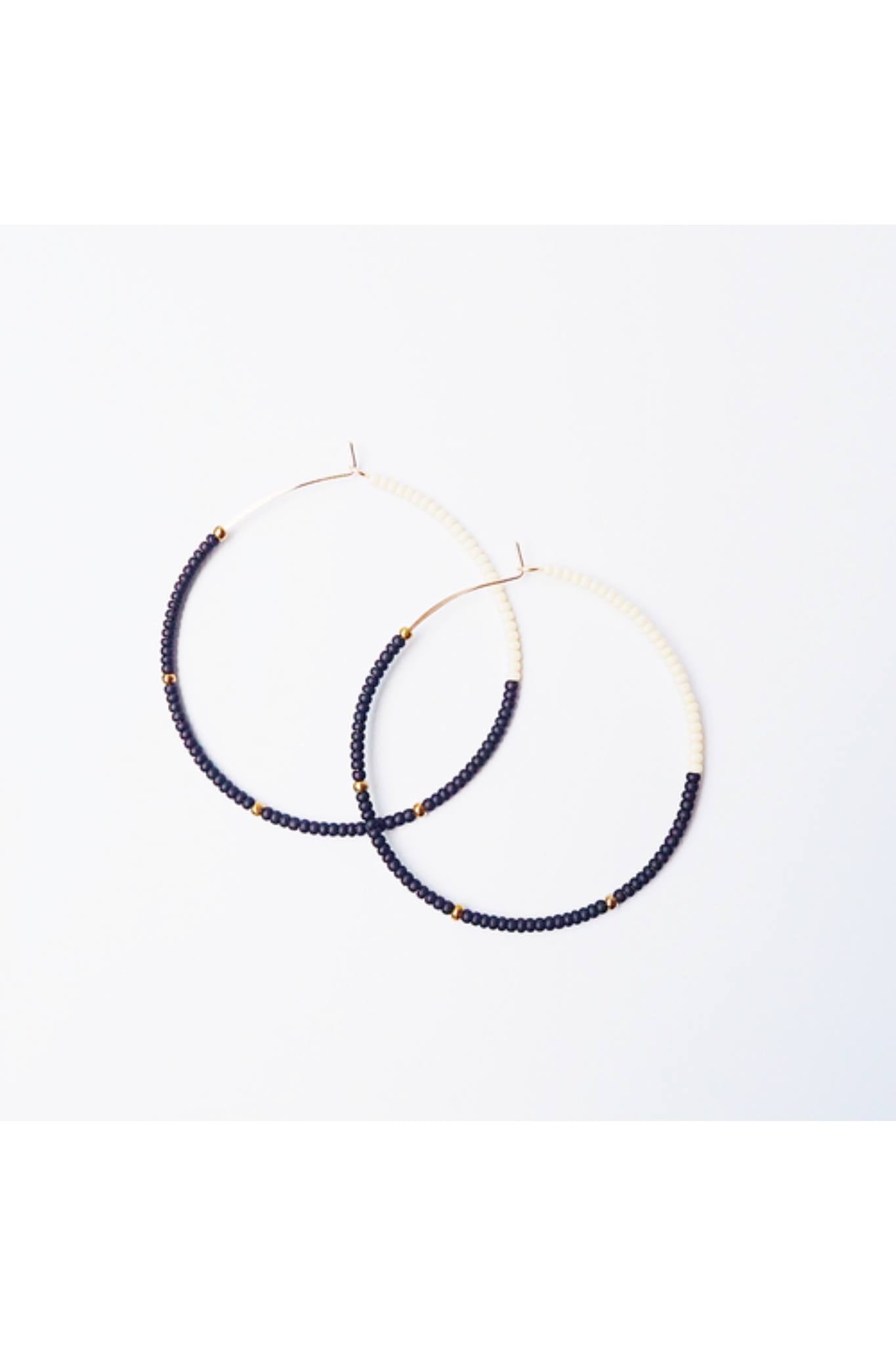 Lightweight 2-inch Cafe Hoops earrings with black and cream glass beads on 14K gold filled wire.