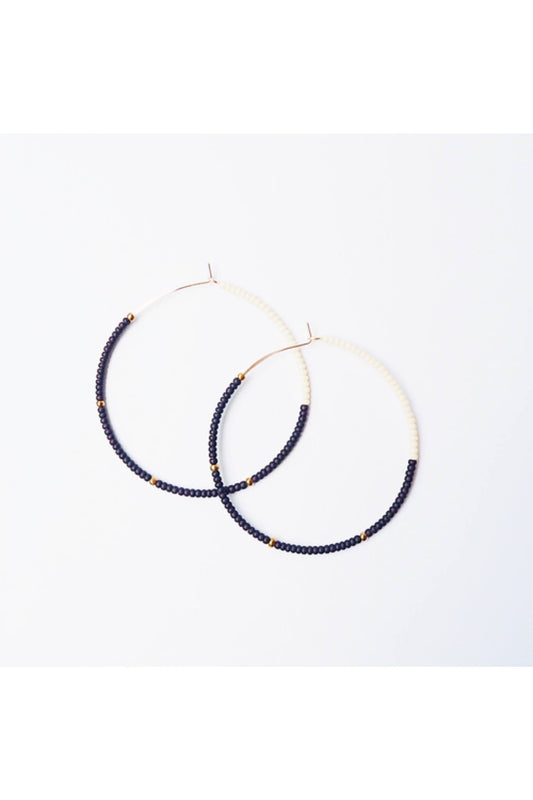 Lightweight 2-inch Cafe Hoops earrings with black and cream glass beads on 14K gold filled wire.
