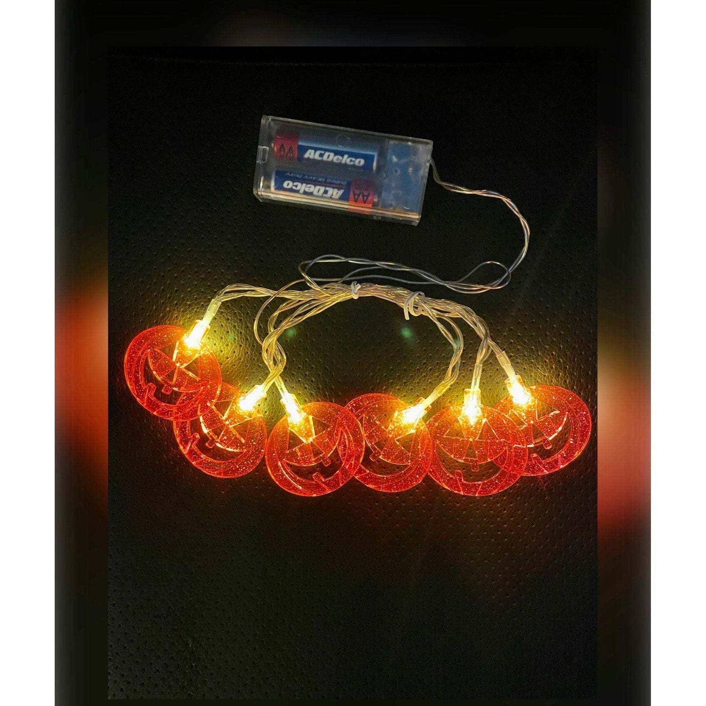 SEASONAL SPECIALITIES Halloween pumpkin string lights with six glowing pumpkins for festive décor.