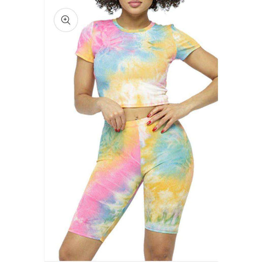 Tie dye ribbed crop top and biker short set in orange and pink.