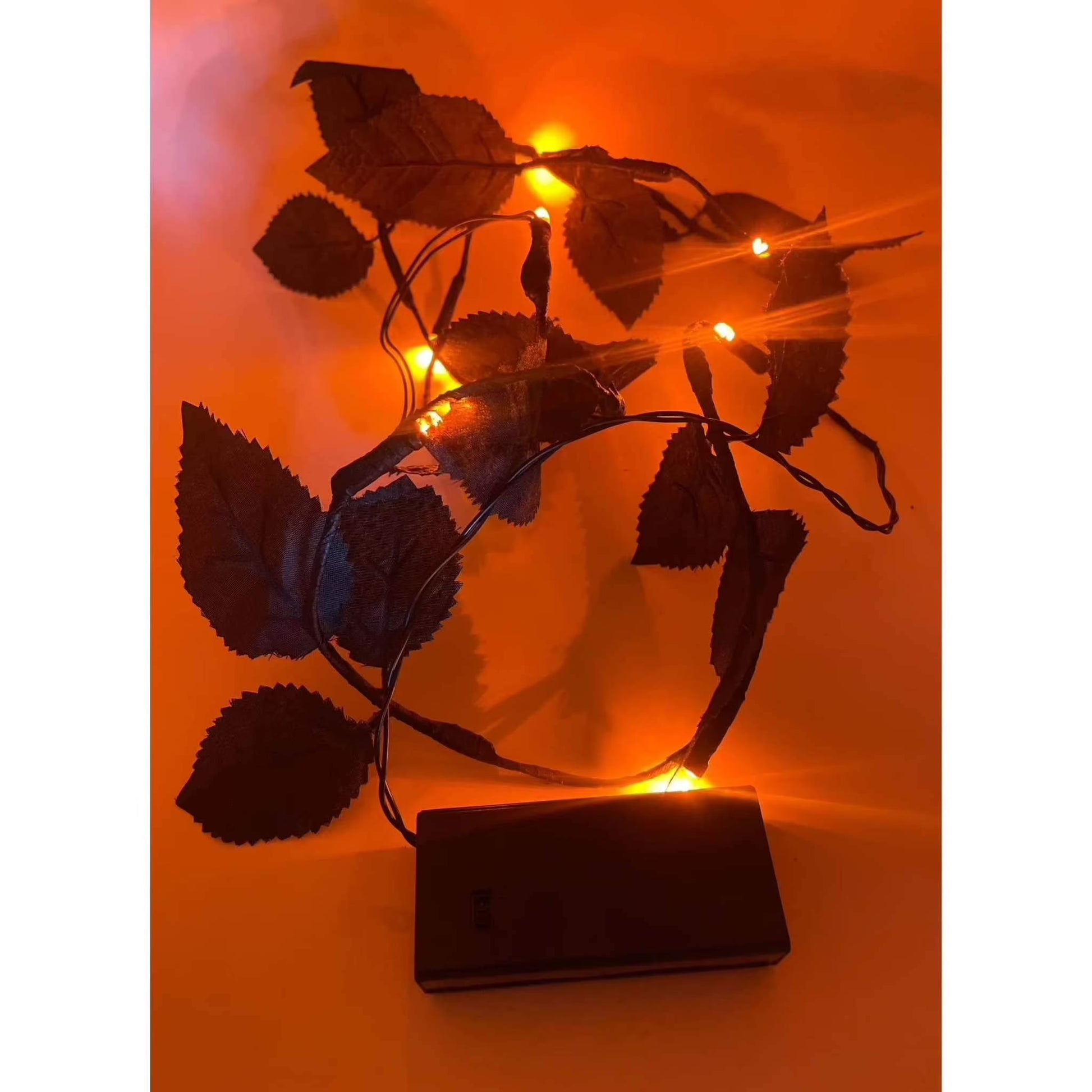 Black Leaf LED Garland Lights with Orange Halloween Glow, 3.5FT, Battery Operated for Indoor Seasonal Decor.
