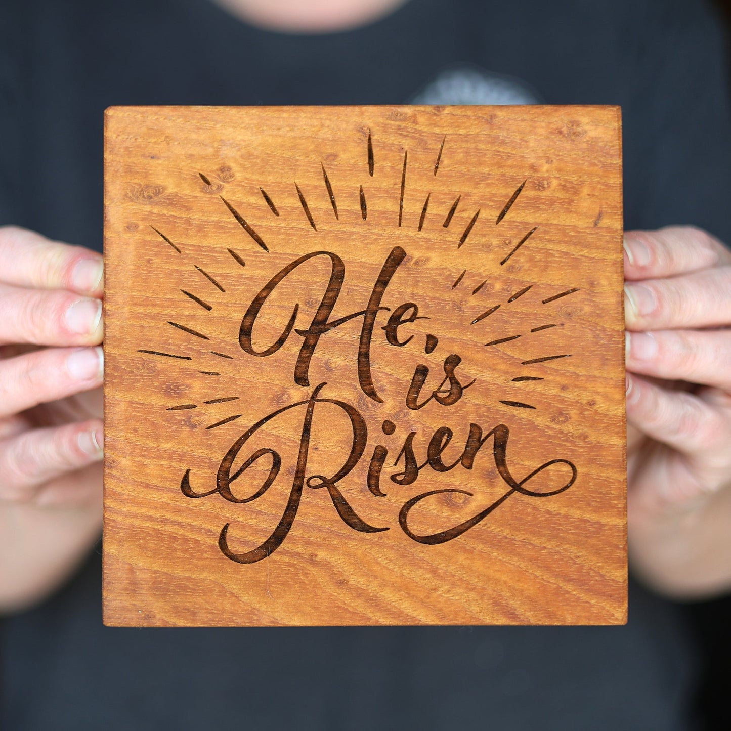 Handcrafted antique chestnut wooden block engraved with "He Is Risen" decorative script and sunburst design