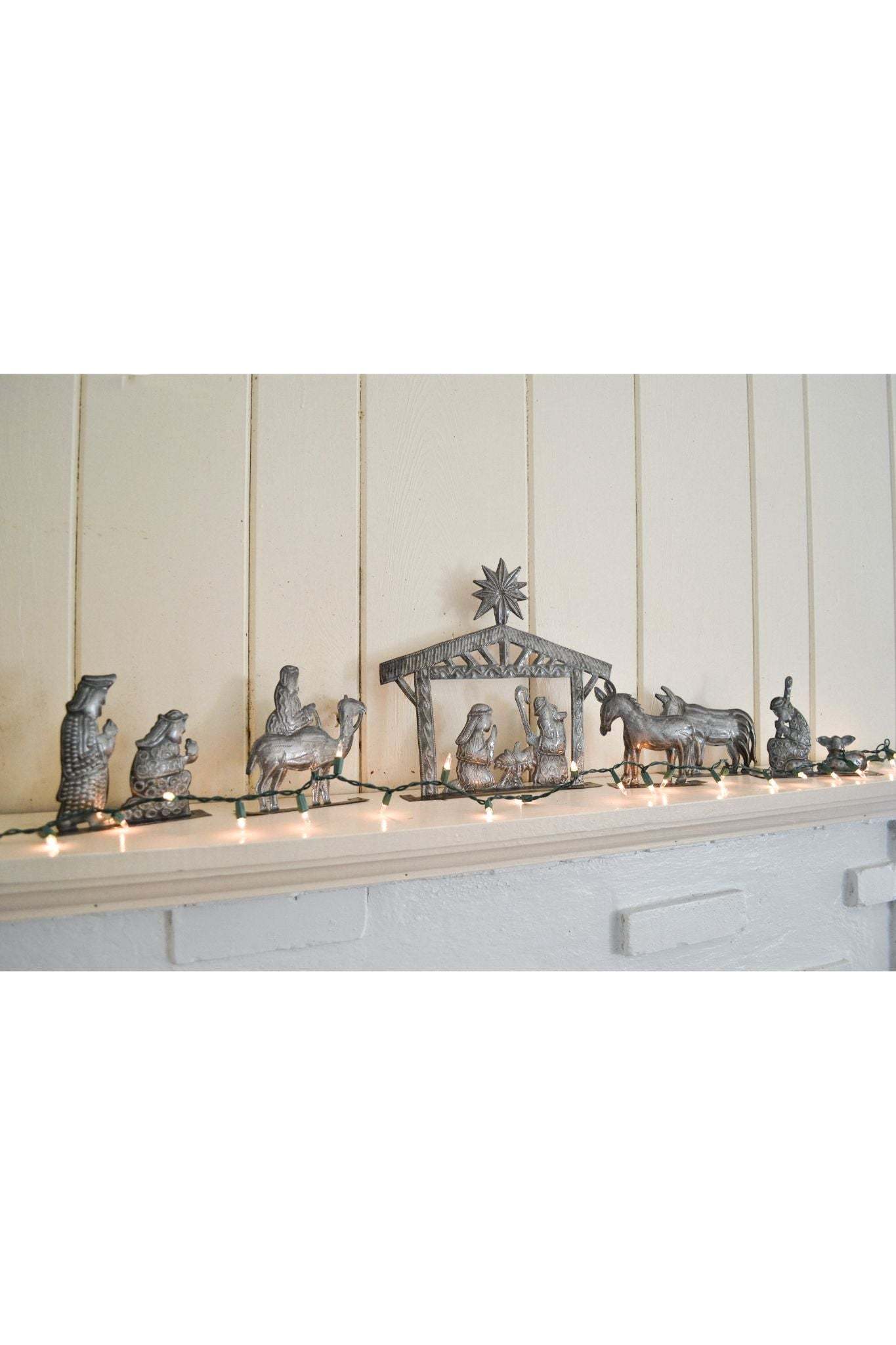 6 Piece Standing Nativity Set made of hand-crafted recycled metal depicting the traditional nativity scene with movable figures.