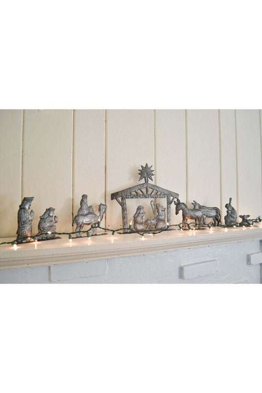 6 Piece Standing Nativity Set made of hand-crafted recycled metal depicting the traditional nativity scene with movable figures.