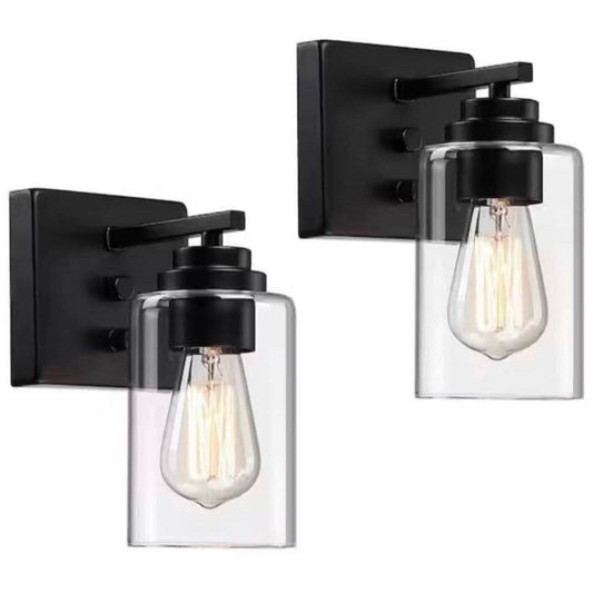 Pia Ricco 4.8 in. black 1-light wall sconce with clear glass shade set of two mounted on wall