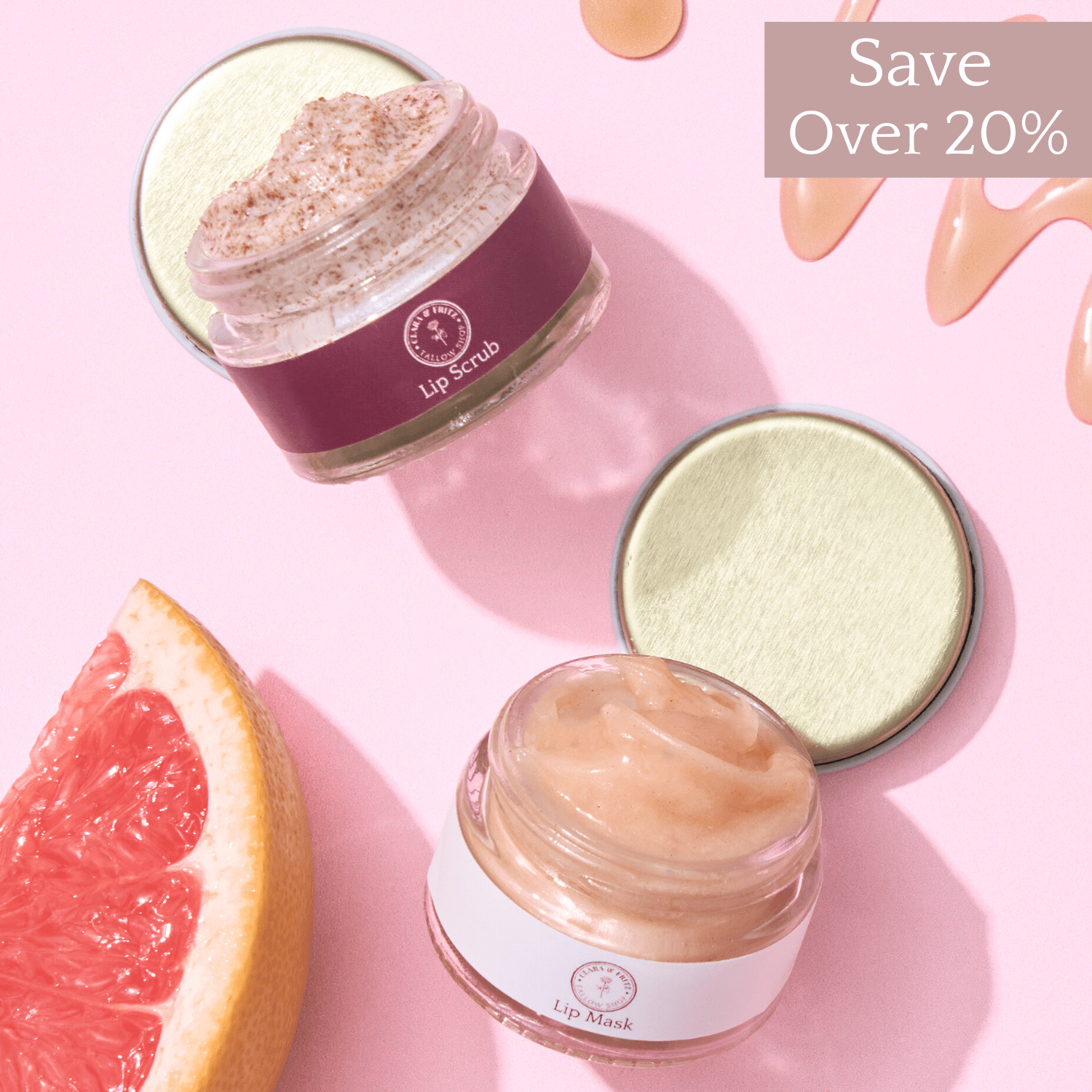 Lip Kit Duo with lip scrub and lip mask jars on pink background with grapefruit slice and "Save Over 20%" text.