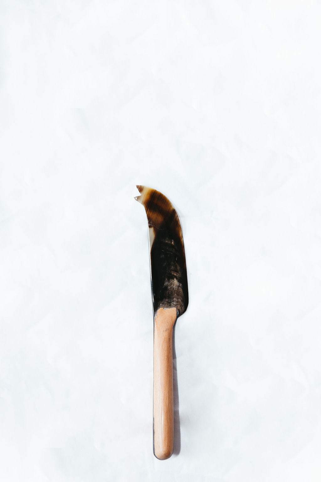 Wood and horn cheese knife with wooden handle and polished horn blade for charcuterie board