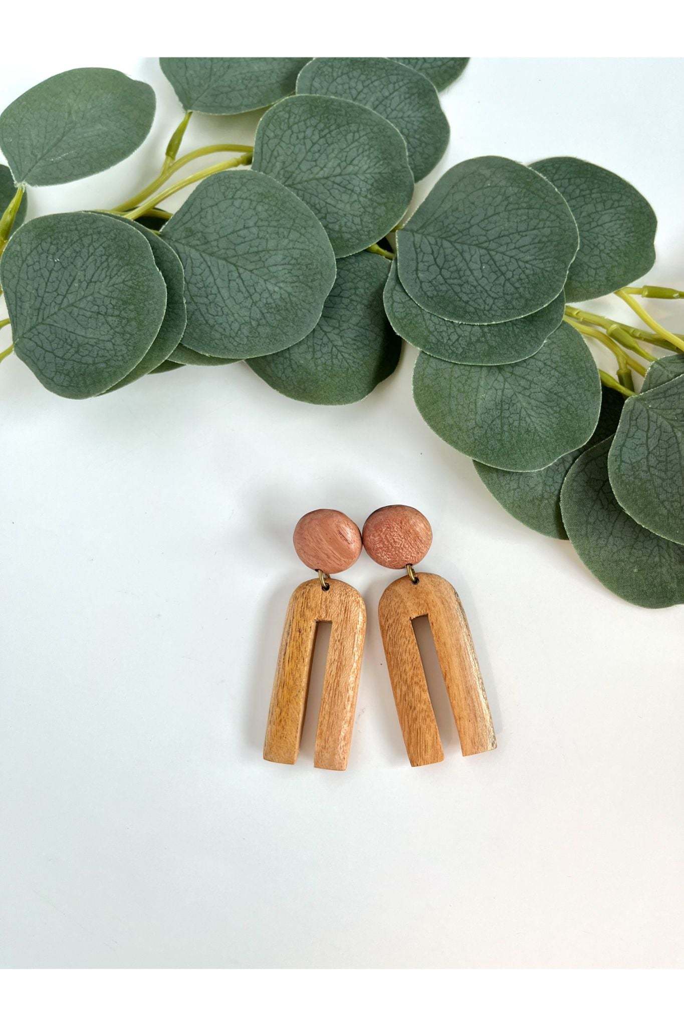 Makaya Mahogany Earrings hand-carved wooden neutral-tone dangle earrings with surgical steel hooks.