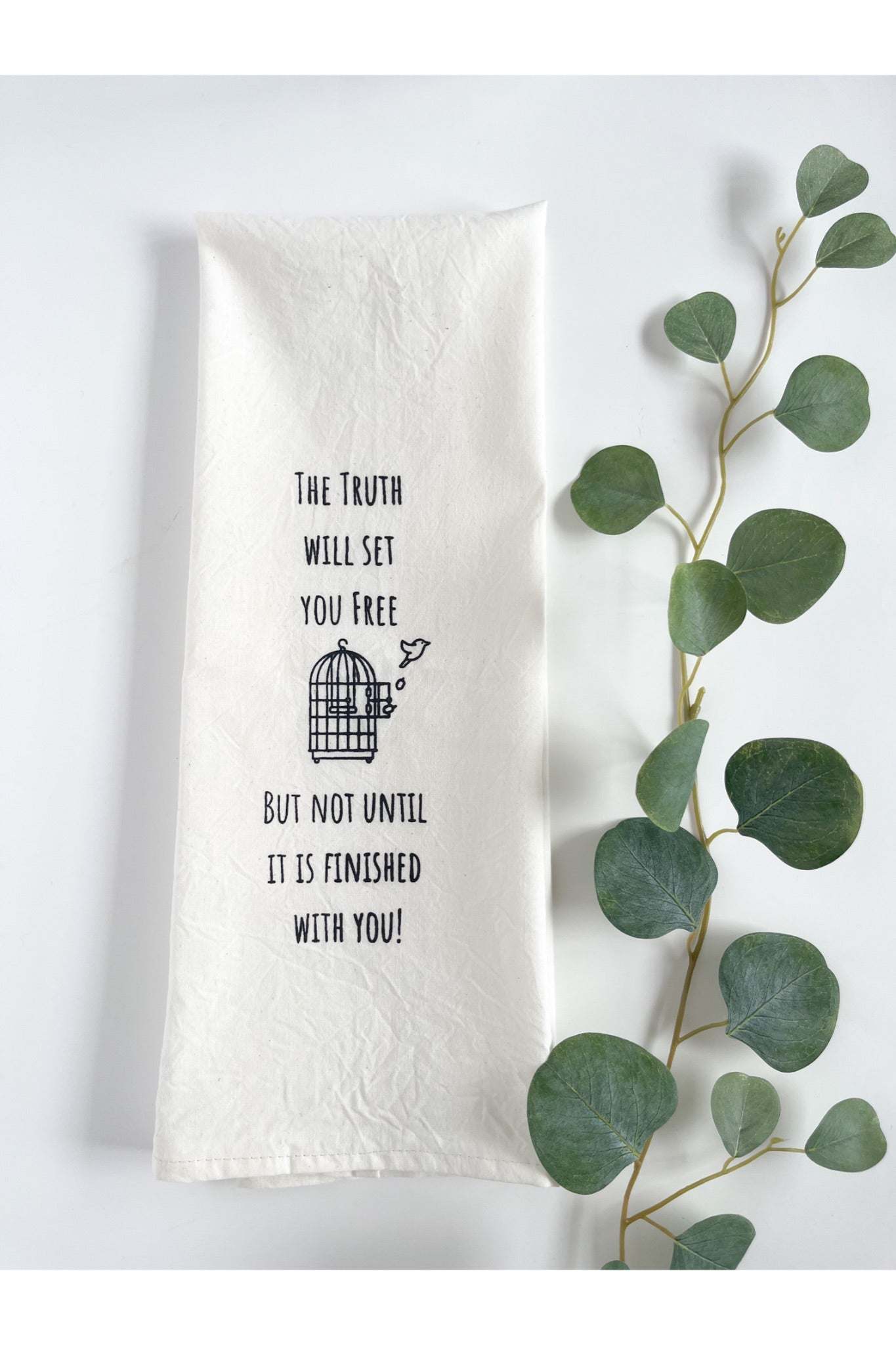 White cotton tea towel with inspirational quote and birdcage design, eco-friendly and locally made.