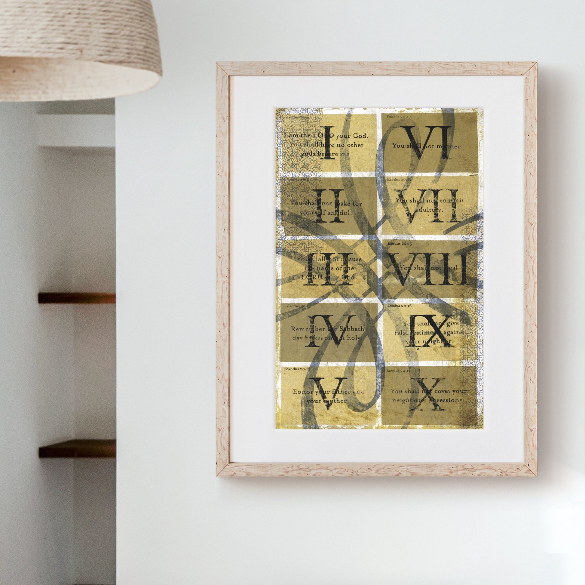 The Ten Commandments Art Print with vintage scrollwork and Roman numerals in a wooden frame on a wall