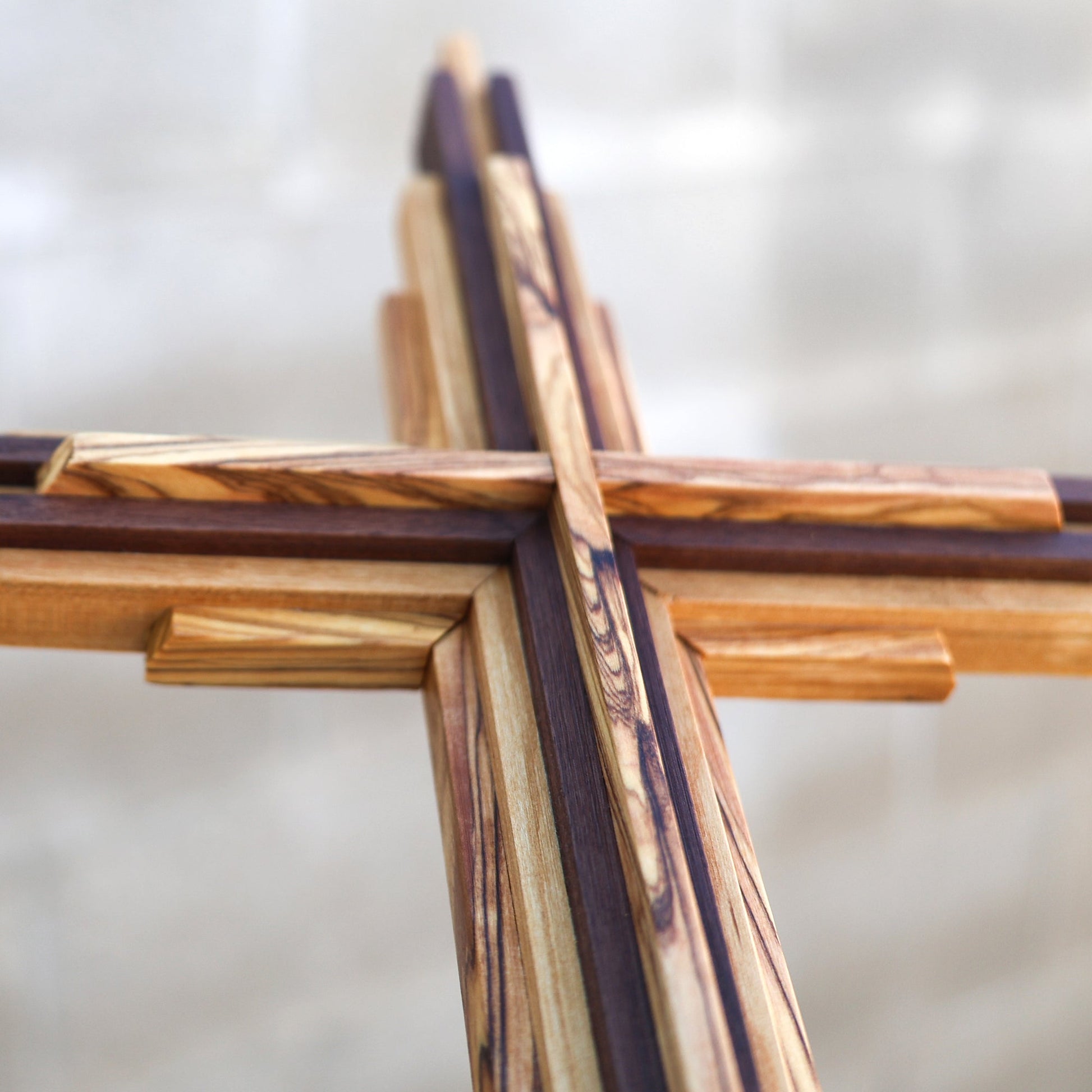 Handcrafted Holy Land Layered Cross made of authentic olive wood, cherry, and walnut with layered design and natural finish.