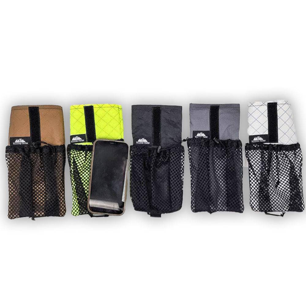 Five different colored cell phone shoulder pouches with mesh pockets, one holding a smartphone.