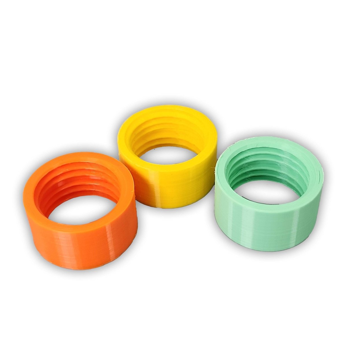 Colorful cleaning coupling adapters for Sawyer Squeeze water filter system, made for backwashing and connecting to standard 28mm bottles