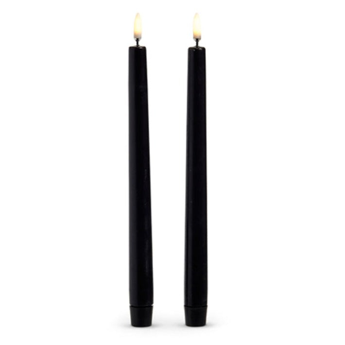 Set of two 10-inch black wax taper candles with flickering flame effect, battery operated for safe and elegant holiday décor.
