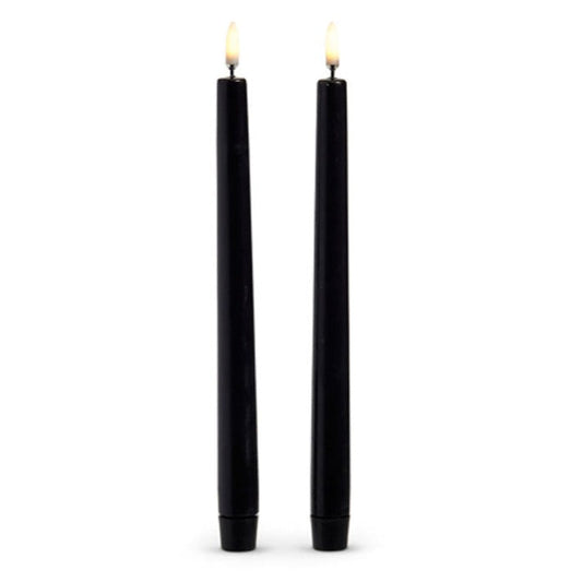Set of two 10-inch black wax taper candles with flickering flame effect, battery operated for safe and elegant holiday décor.