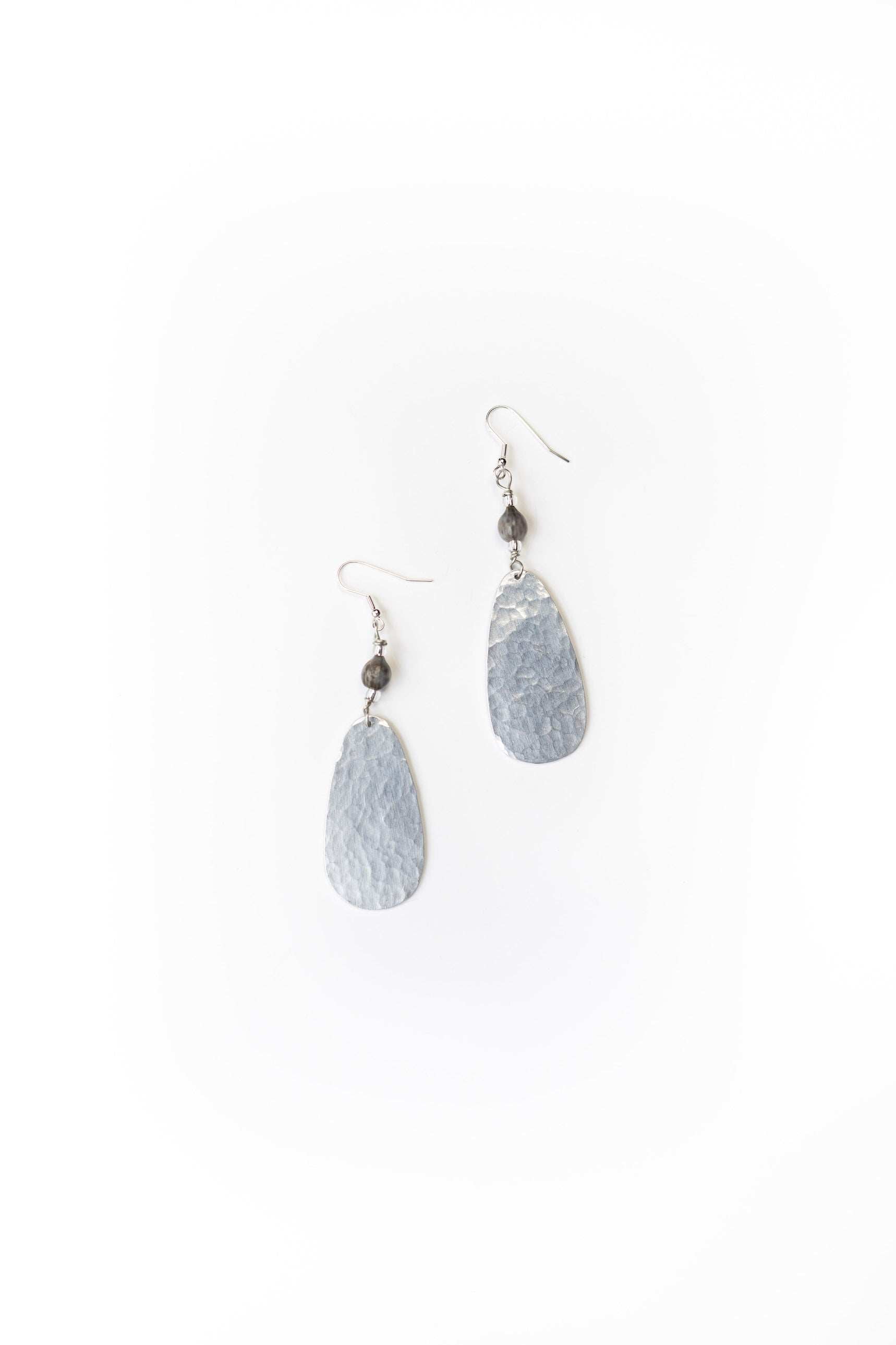 Ellipse hammered aluminum earrings with majok seed beads and silver-plated brass hooks