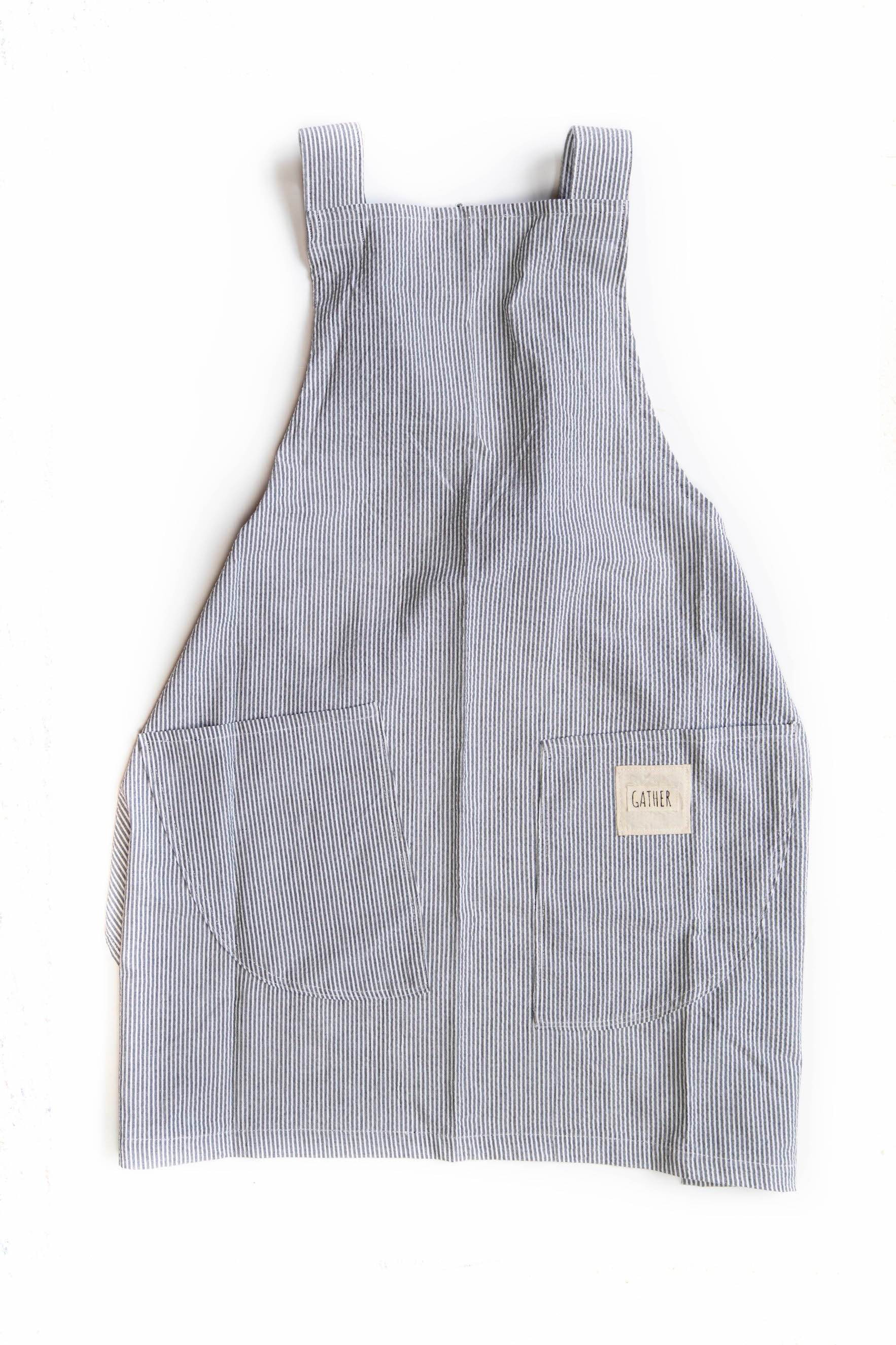 Gray cotton seersucker Harvest Apron with cross straps and front pockets for tools or utensils