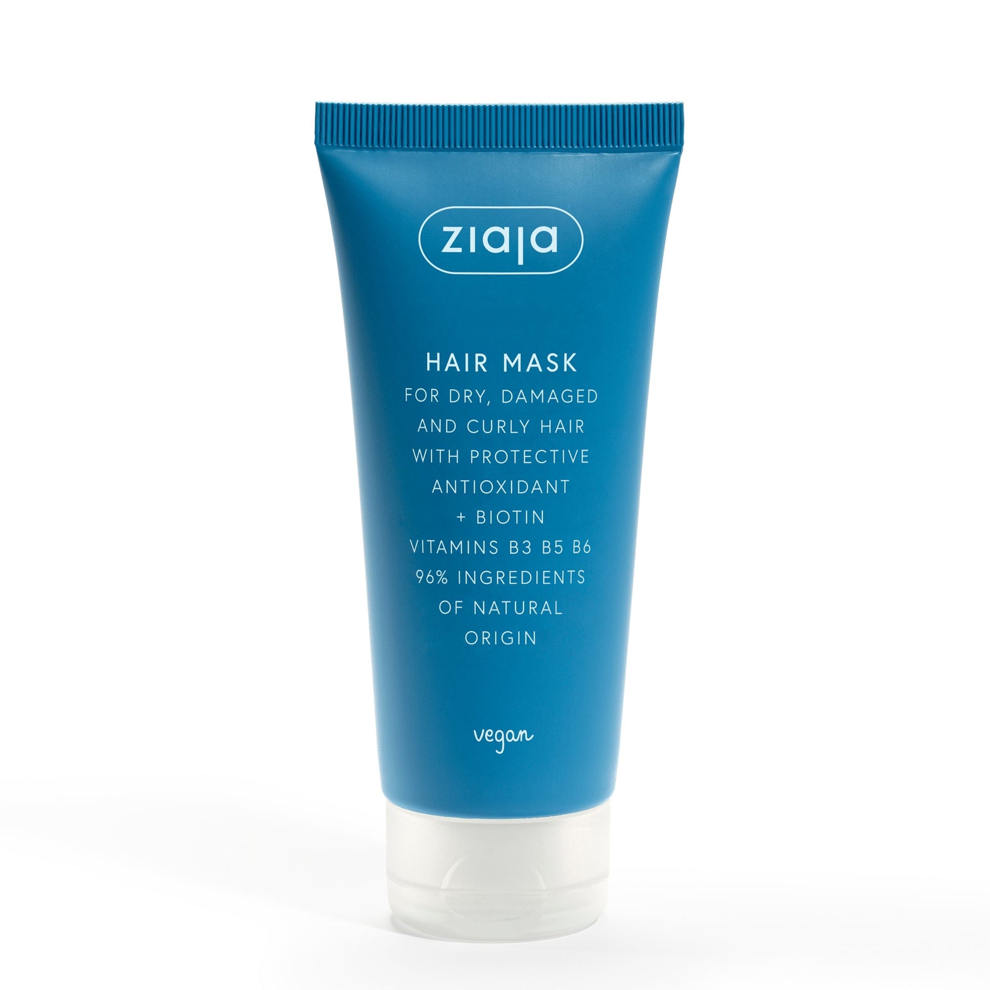 Blue tube of Ziaja Antioxidant Hair Care hair mask for dry, damaged, and curly hair with biotin and vitamins B3, B5, B6, containing 96% natural ingredients and vegan formula.