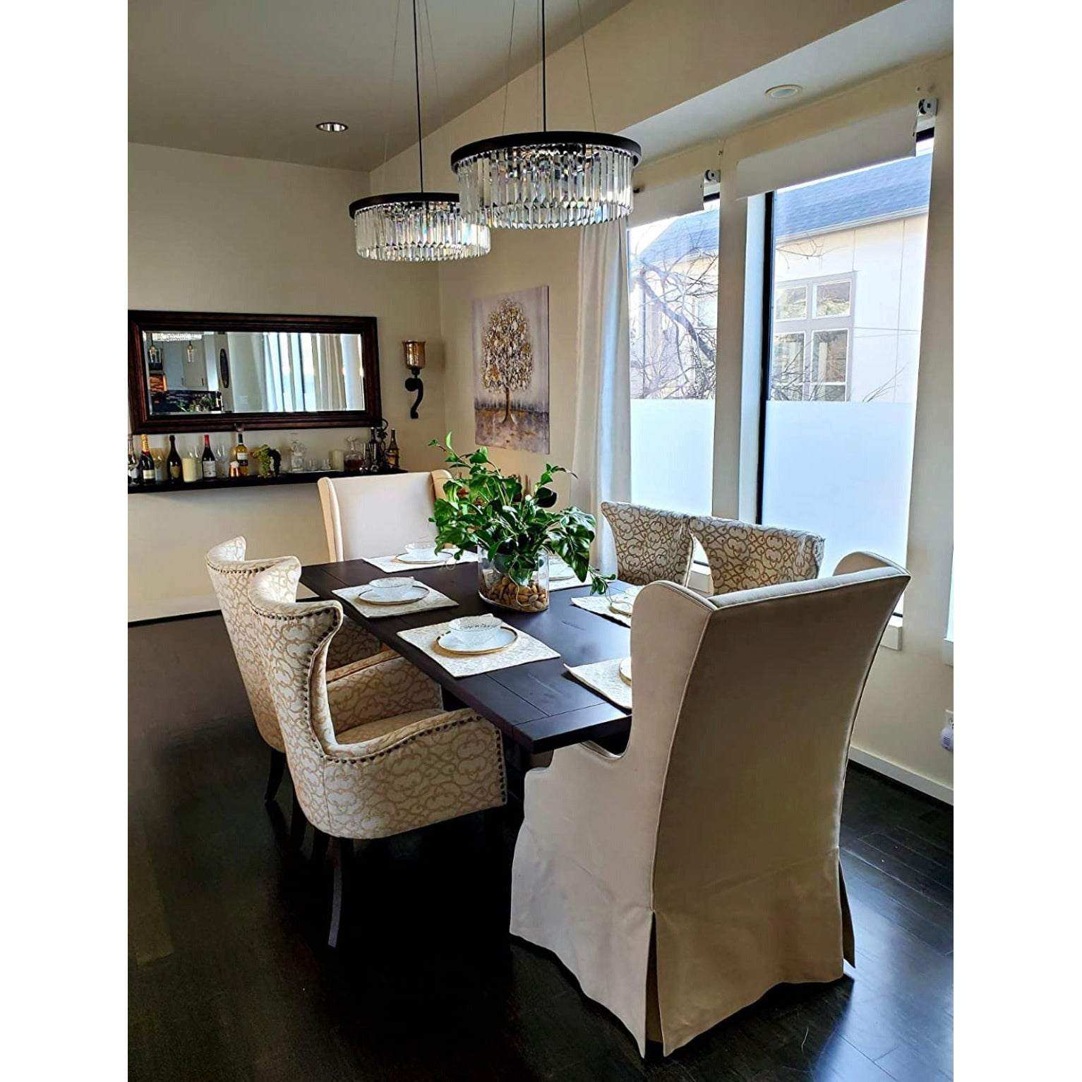 Wellmet Modern Crystal Chandelier with 6 Lights over dining room table.