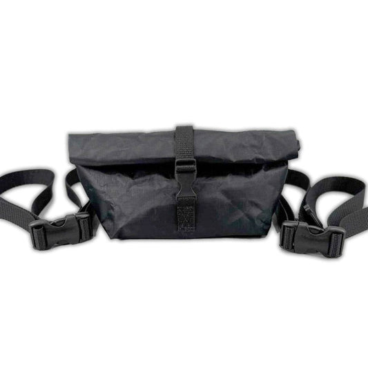 Black ultralight Dyneema roll top fanny pack with adjustable straps and buckle closure designed for hiking and outdoor use