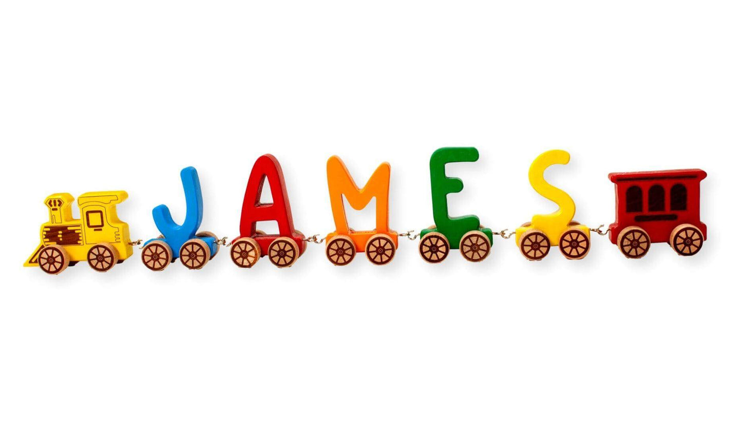 Wooden Letter Train puzzle spelling JAMES in colorful letters on connected train cars for kids