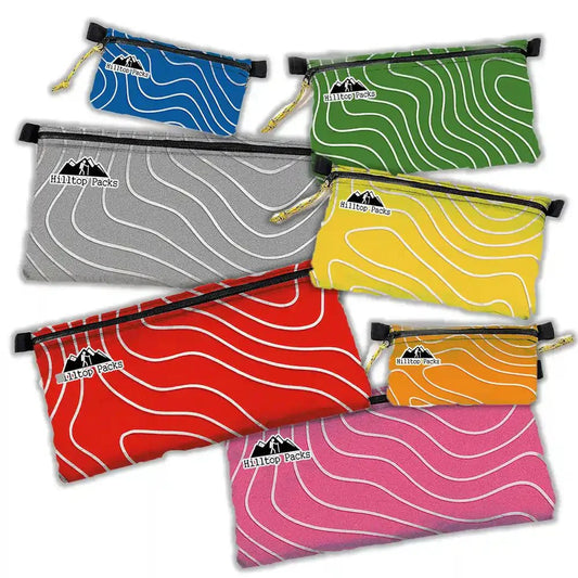 Ultralight zipper pouches in multiple sizes and colors made from waterproof D50T fabric with weather-resistant zippers for outdoor gear organization.